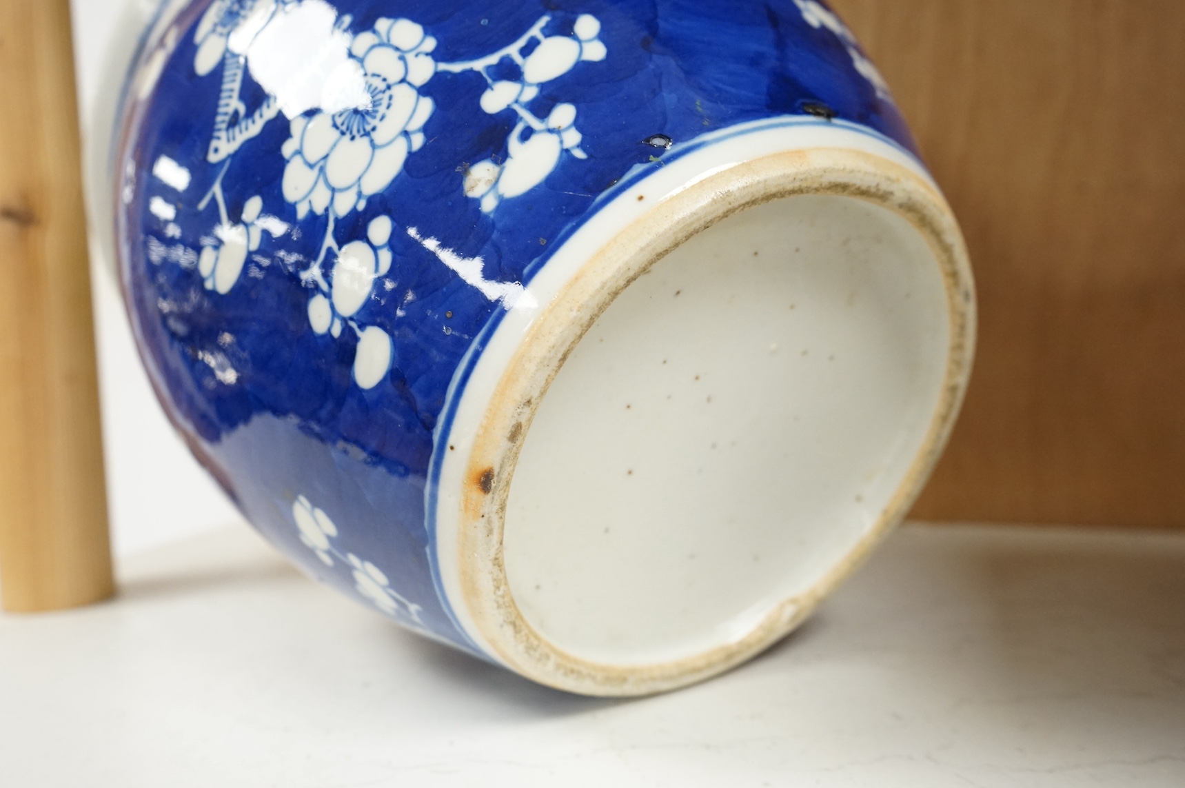 A Chinese blue and white ‘prunus’ jardiniere, 20cm tall. Condition- chipped